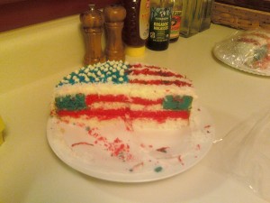 Salute to sweetness! Coconut - infused frosting between layers of red, white, and blue cake! Almost all of the 51 stars fit, but I ran out of room on star #48.