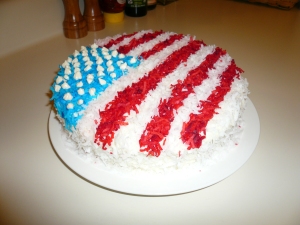 My version of Fourth of July Flag Cake - (decked with red, white, and blue coconut ) A side -view!